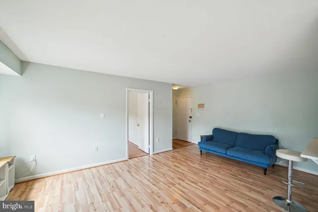 a view of bedroom with furniture and wooden floor