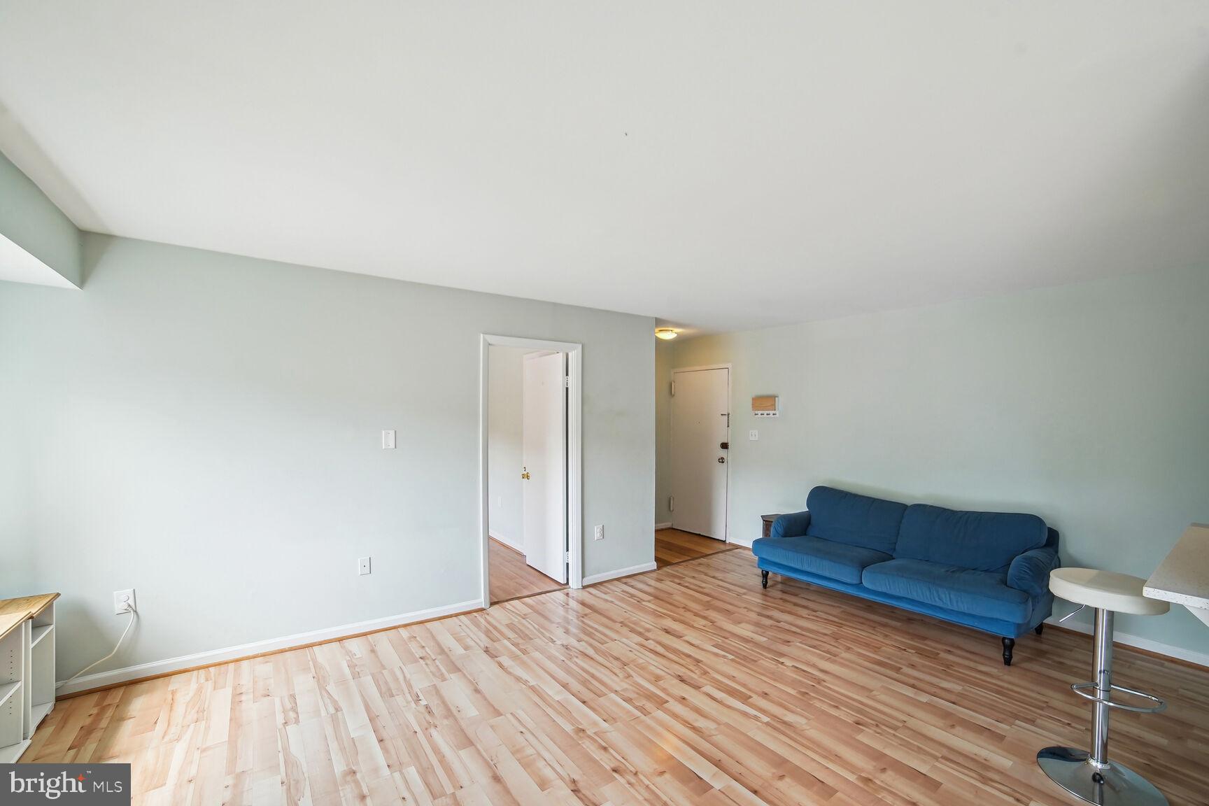 12200 Braxfield Court, Unit 209 Rockville, MD 20852 - Photo 7 of 17 a view of bedroom with furniture and wooden floor