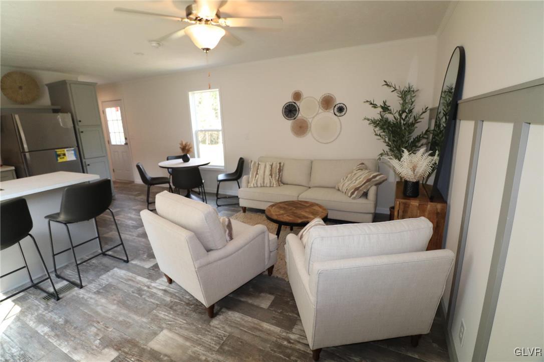 5023 Old Timber Road Stroudsburg, PA 18360 - Photo 5 of 28 a living room with furniture and a painting