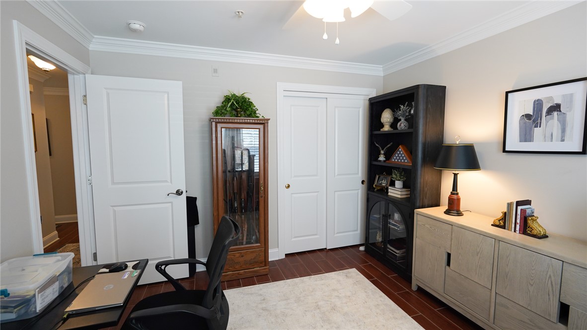 303 Lookover Drive Anderson, SC 29621 - Photo 27 of 46 An inviting room features rich wood flooring, crown molding, and bright recessed lighting.