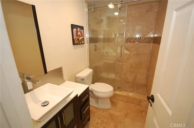 a bathroom with a sink vanity and a mirror