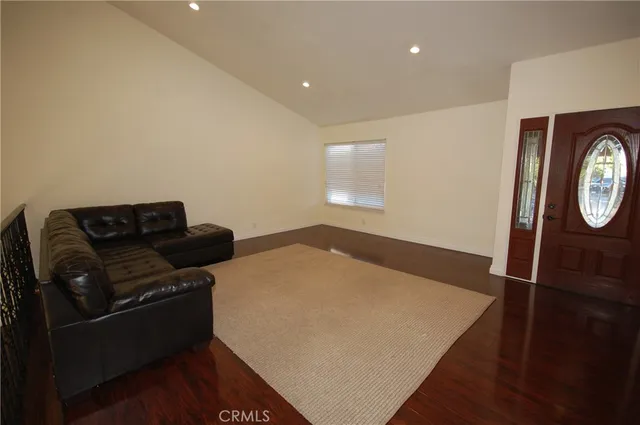 a view of livingroom with furniture wooden floor and window