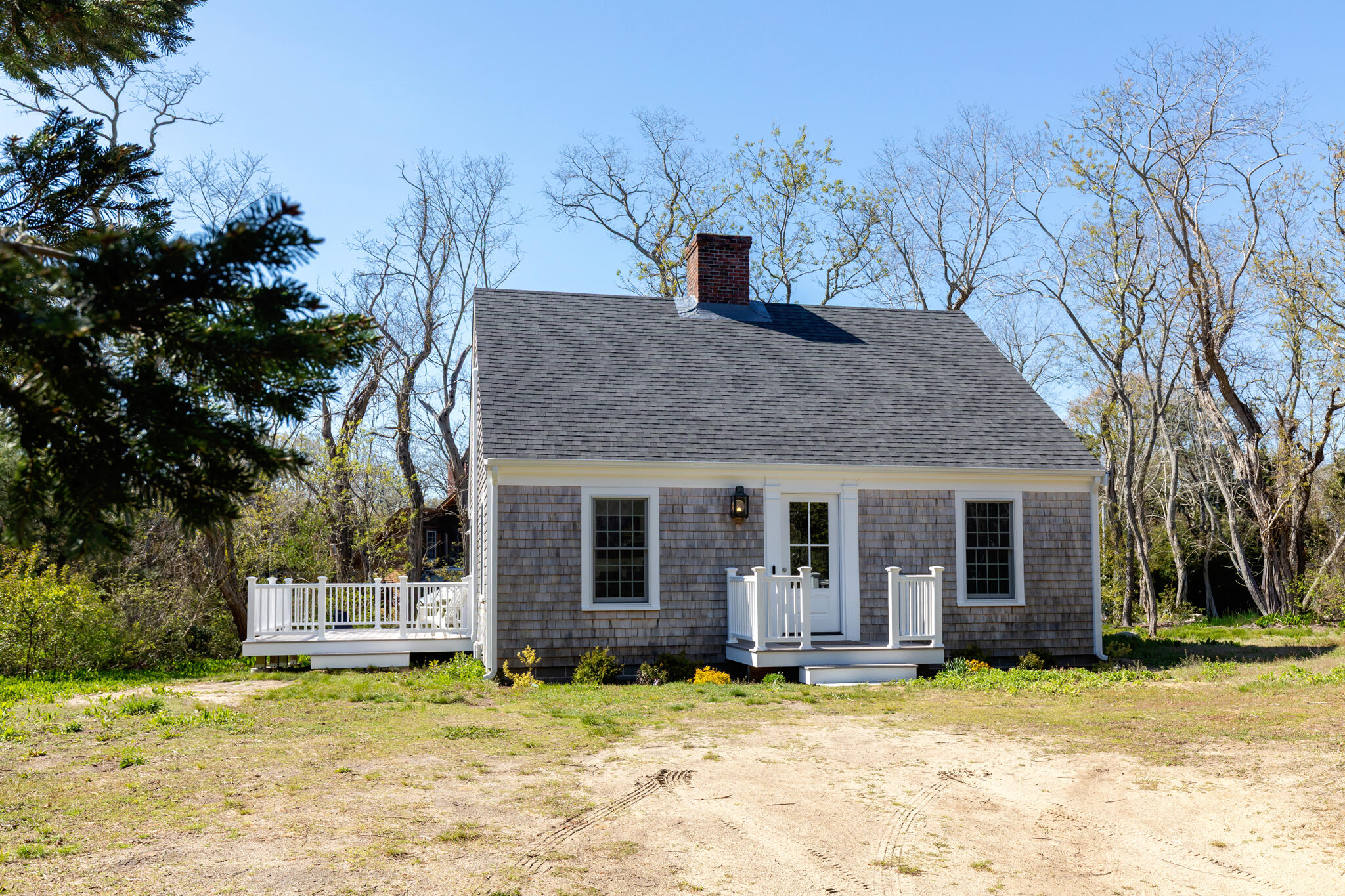 1295 Massasoit Road Eastham, MA 02642 - Photo 3 of 32 a house that has a tree in front of it