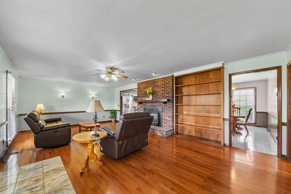 a kitchen with cabinets appliances and a window