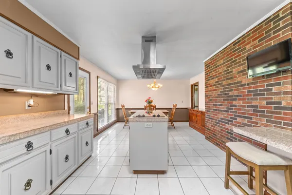 a bathroom with a shower and a glass door