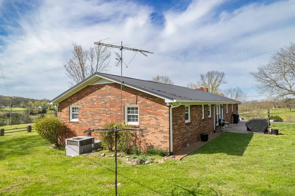 a view of a yard with swimming pool