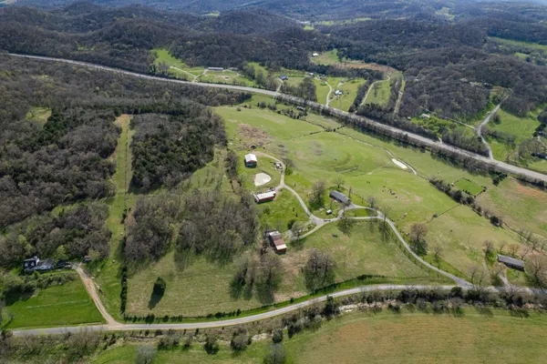a view of a lake with houses in the back