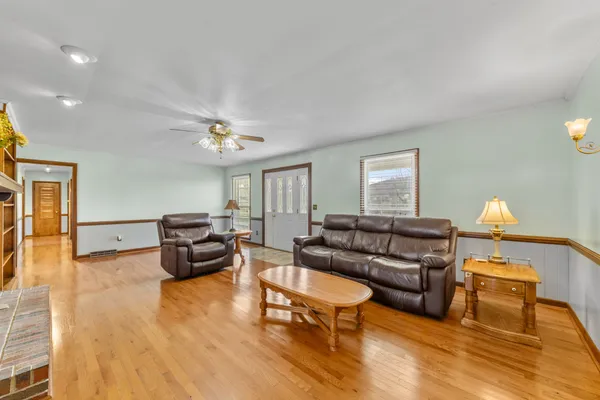 a view of a livingroom with furniture and a fireplace