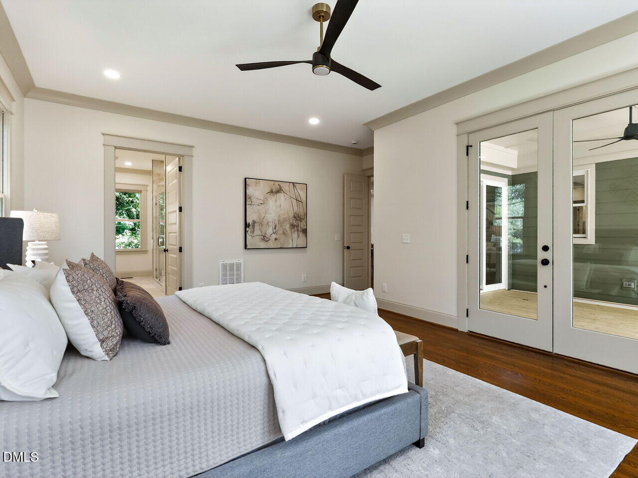 504 Tilden Street Raleigh, NC 27605 - Photo 33 of 58 a bedroom with a large bed and a chandelier