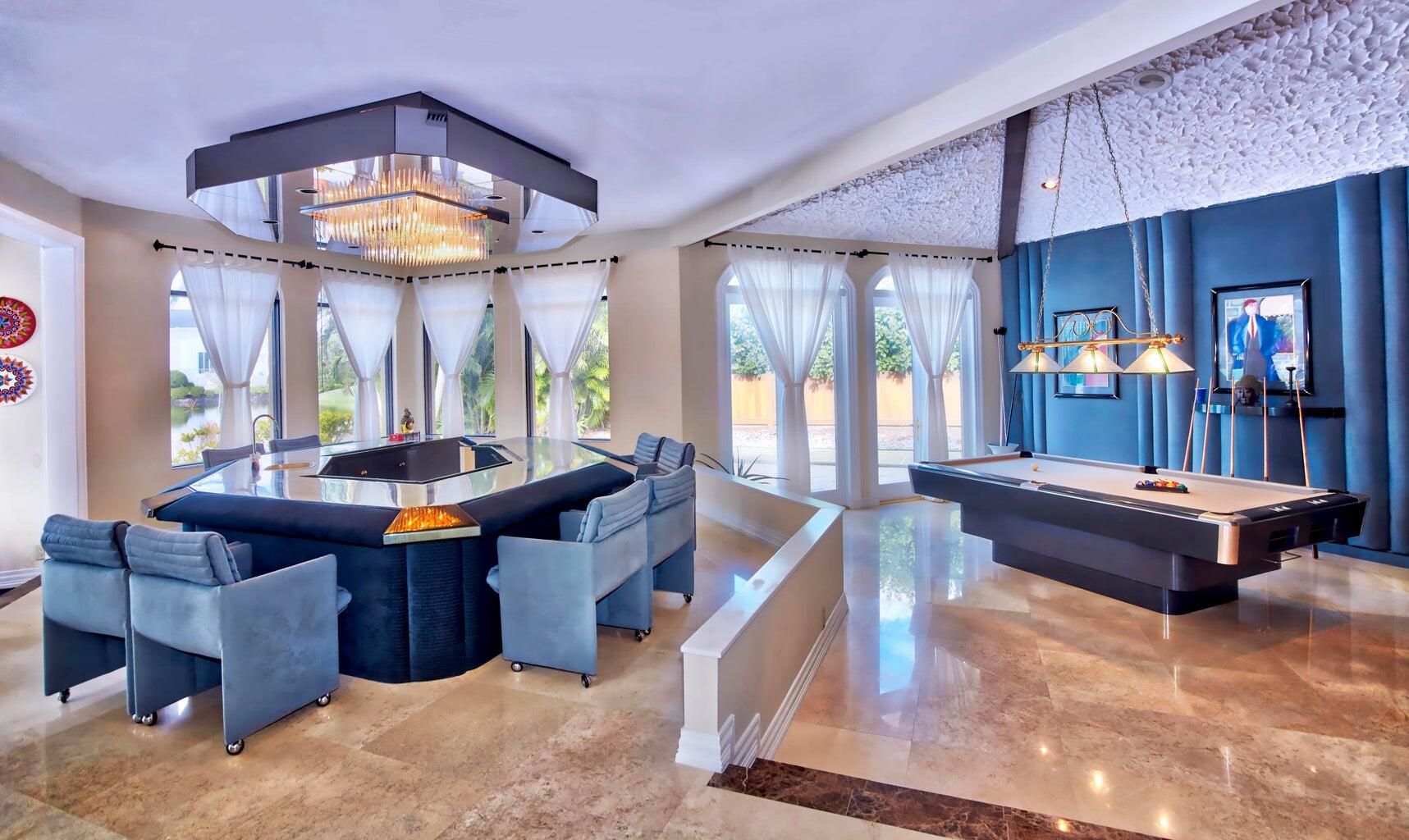 21125 Hamlin Drive Boca Raton, FL 33433 - Photo 15 of 69 a living room with furniture a chandelier and a large window