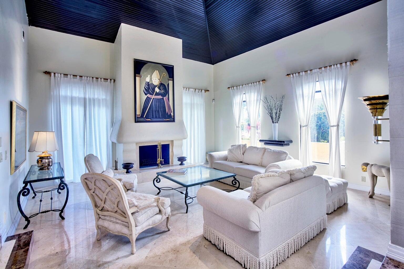 21125 Hamlin Drive Boca Raton, FL 33433 - Photo 17 of 69 a living room with furniture fireplace and wall painting
