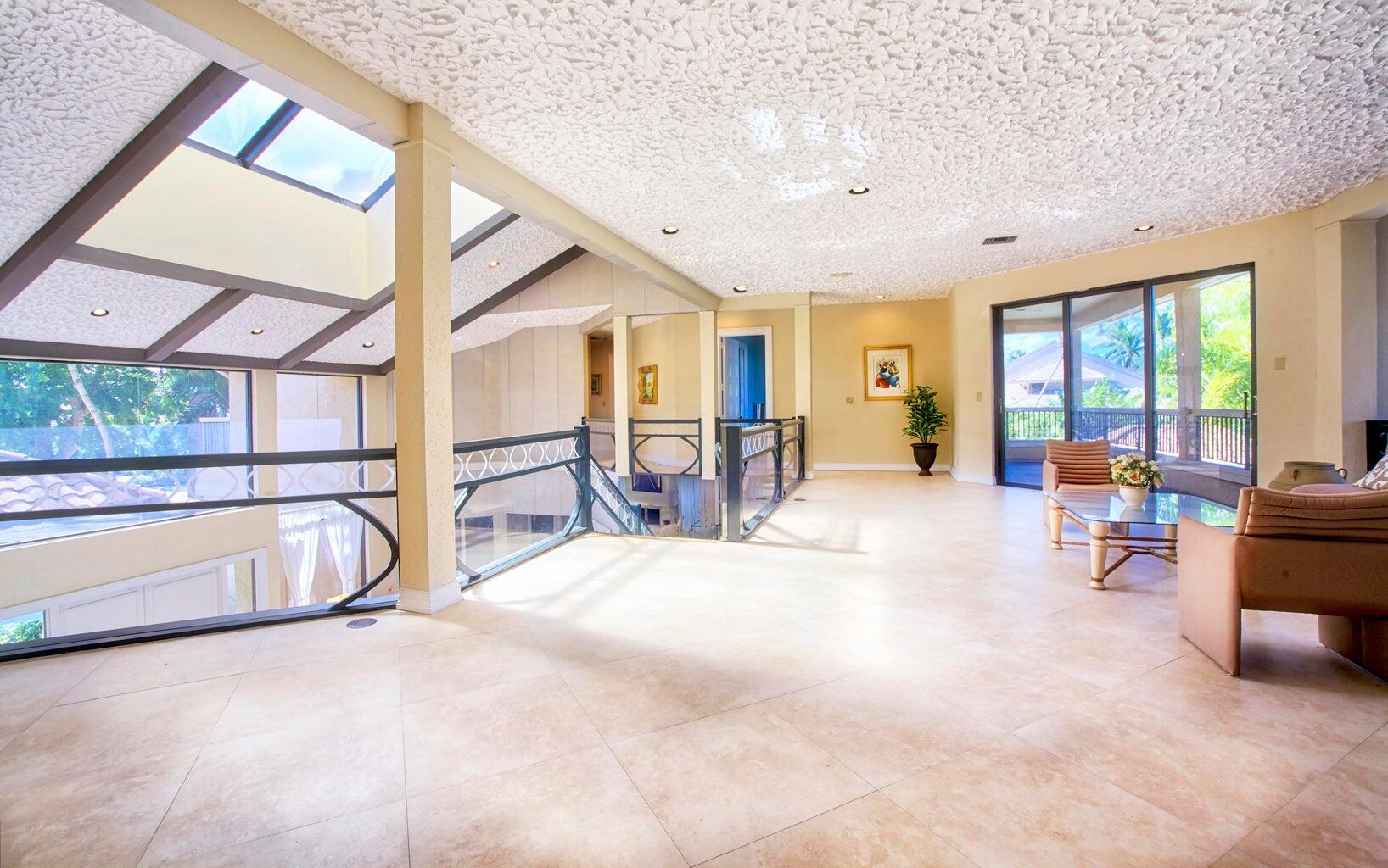21125 Hamlin Drive Boca Raton, FL 33433 - Photo 32 of 69 a view of a livingroom with furniture and a large window
