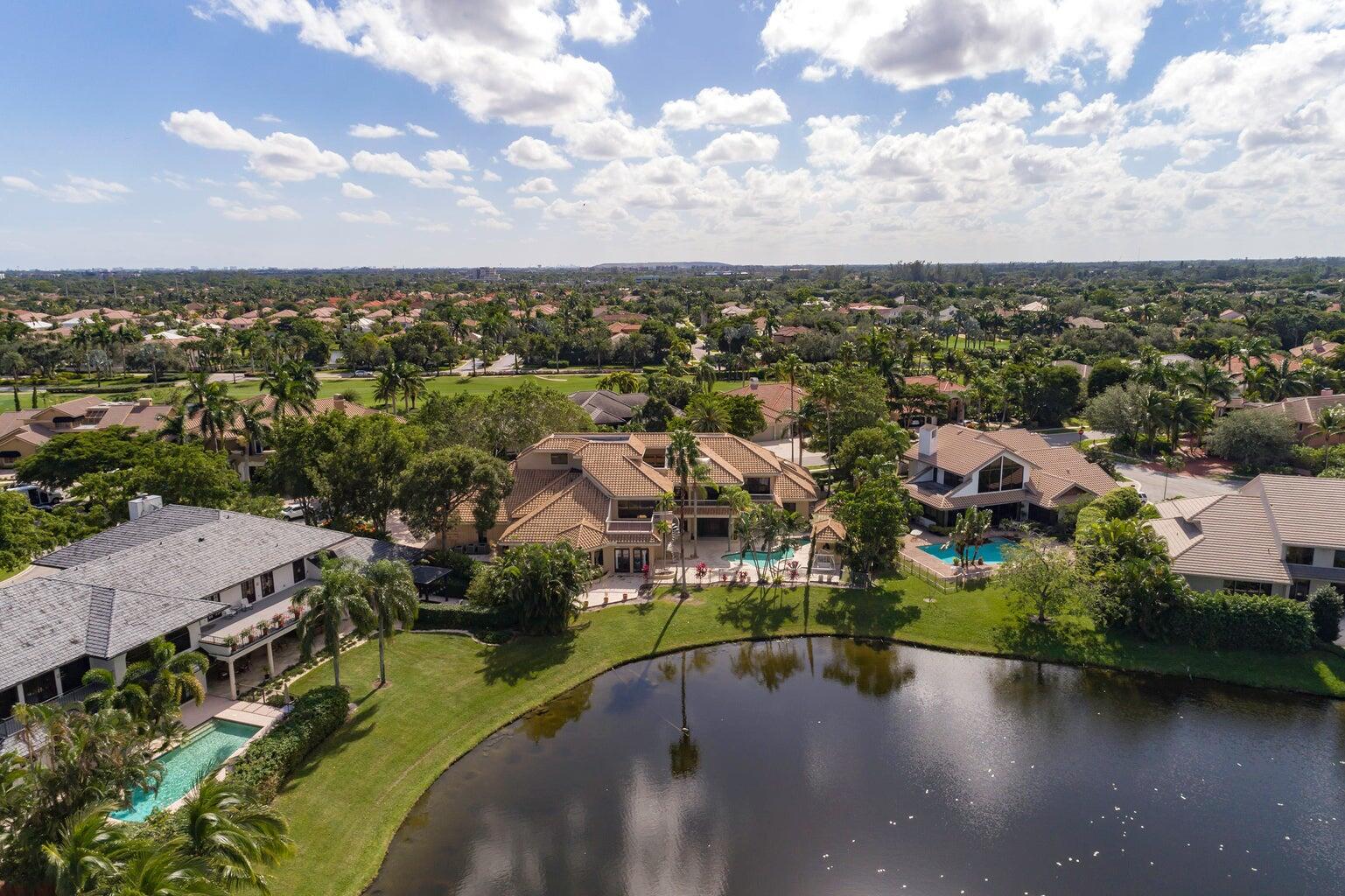 21125 Hamlin Drive Boca Raton, FL 33433 - Photo 48 of 69 an aerial view of a city with lots of residential buildings ocean and mountain view in back