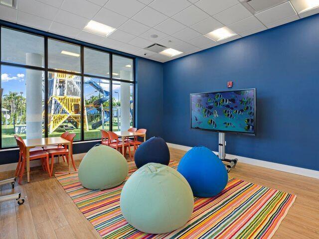 21125 Hamlin Drive Boca Raton, FL 33433 - Photo 54 of 69 a living room with furniture and large windows