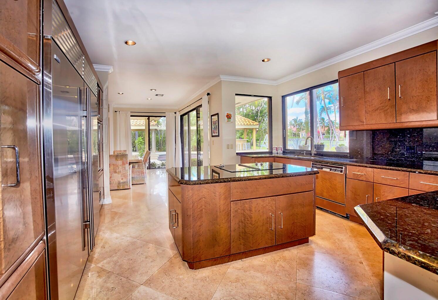 21125 Hamlin Drive Boca Raton, FL 33433 - Photo 10 of 69 a large kitchen with stainless steel appliances granite countertop a large counter top a stove a refrigerator and a sink