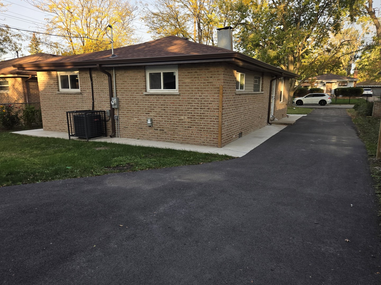 16118 Paulina Street Markham, IL 60428 - Photo 2 of 3 a front view of a house with a yard and garage
