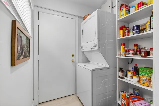 a sign of golf club on a wall under a tree