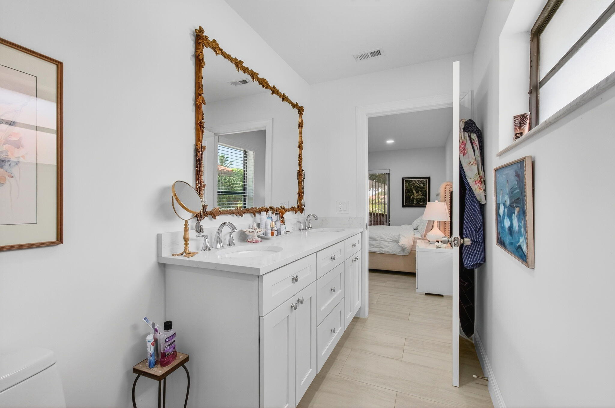 6248 Kings Gate Circle Delray Beach, FL 33484 - Photo 15 of 111 a en suite bathroom with a double vanity sink and a mirror
