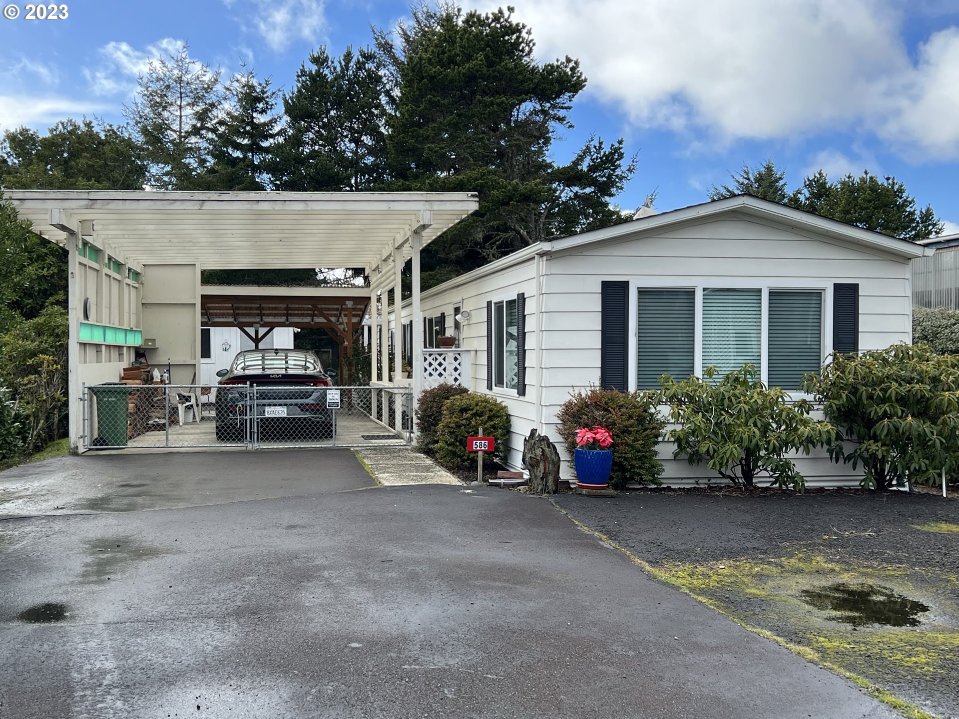1601 Rhododendron Drive, Unit 586 Florence, OR 97439 - Photo 1 of 22 a view of a car park in front of house