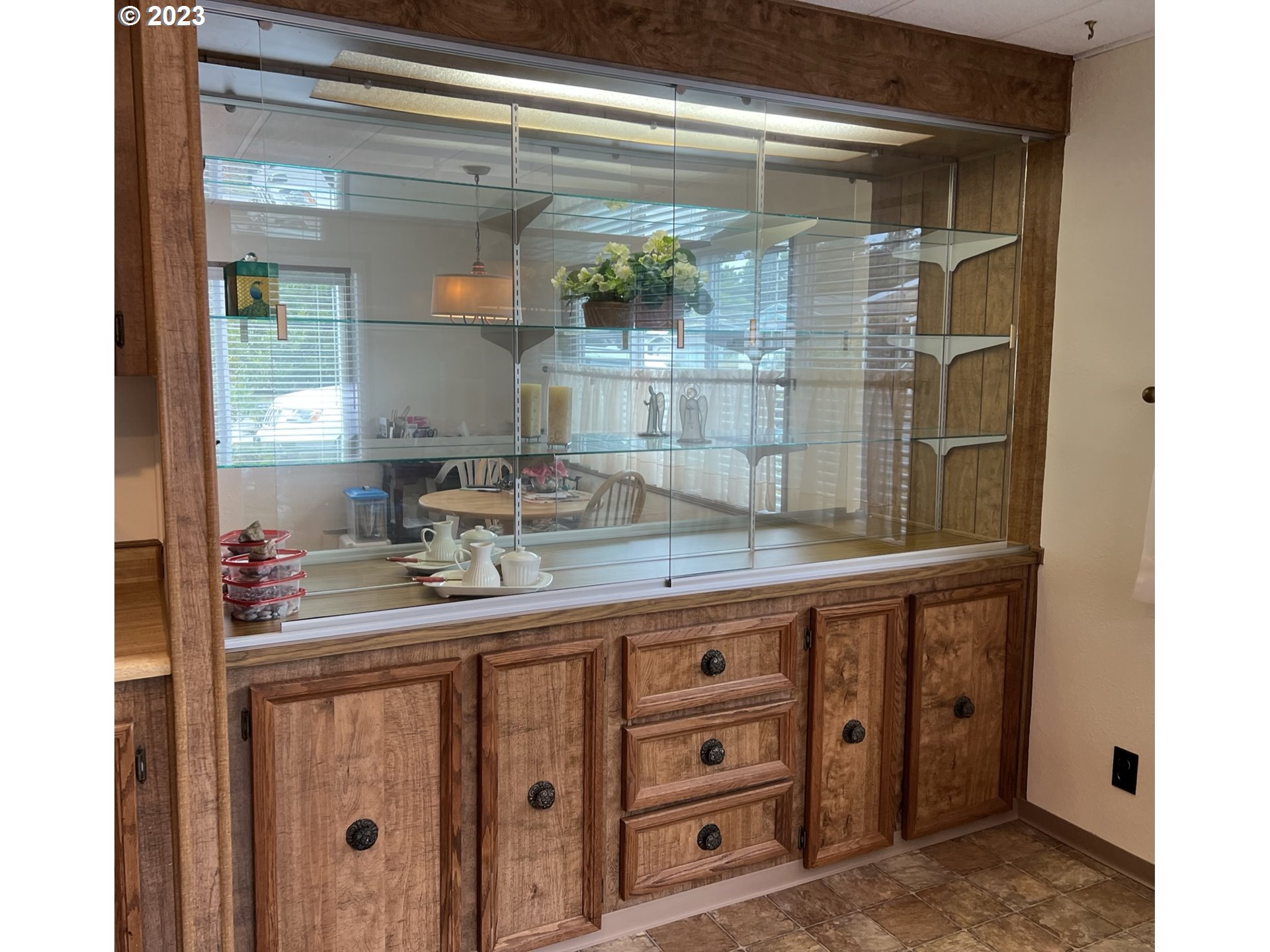 1601 Rhododendron Drive, Unit 586 Florence, OR 97439 - Photo 13 of 22 a bathroom with a granite countertop sink a mirror and shower