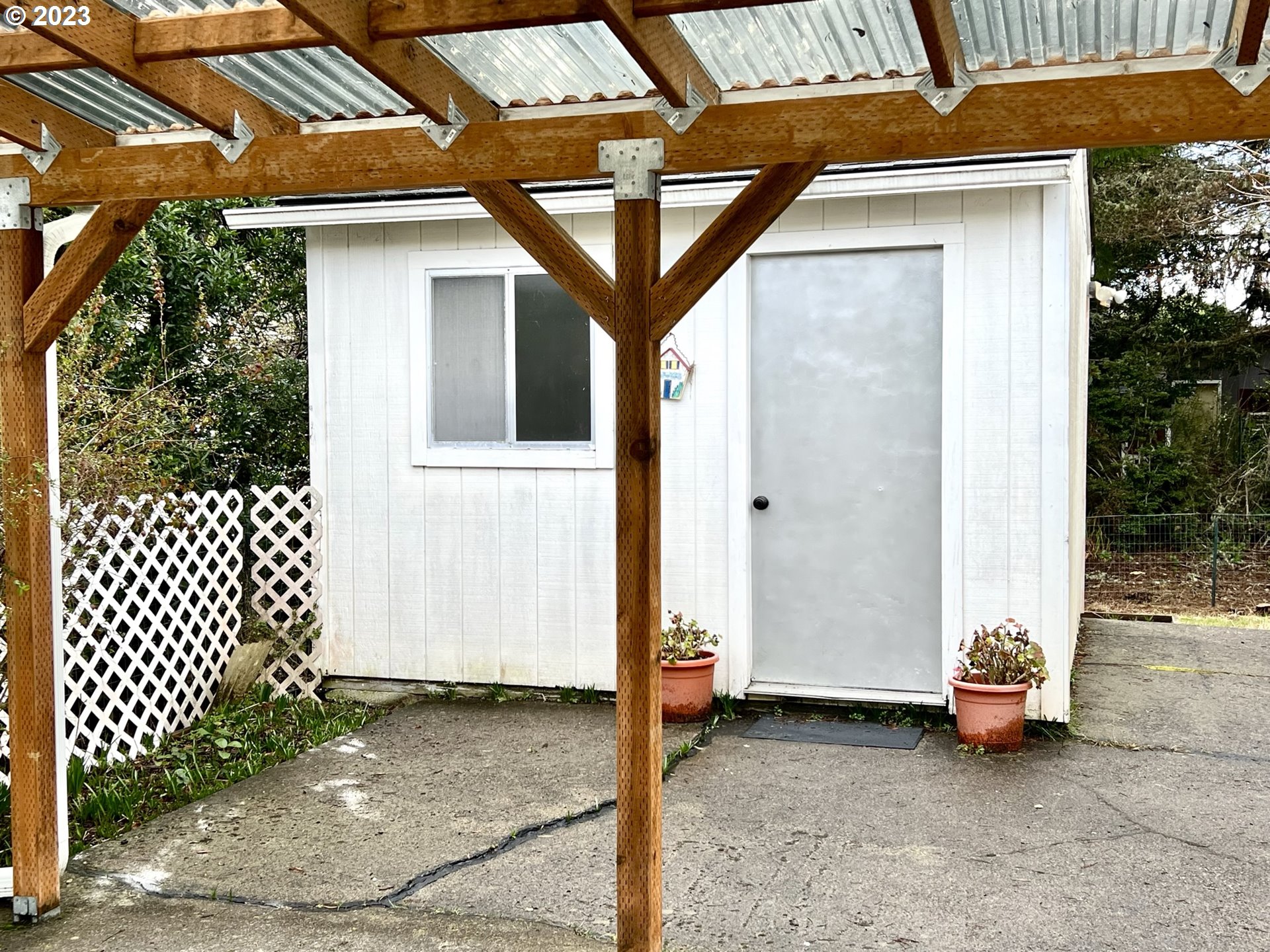 1601 Rhododendron Drive, Unit 586 Florence, OR 97439 - Photo 20 of 22 a view of a house with backyard