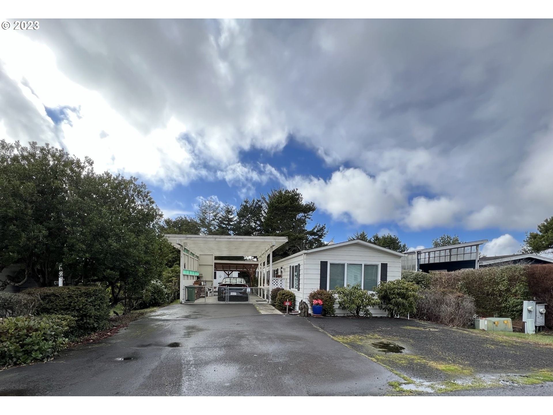 1601 Rhododendron Drive, Unit 586 Florence, OR 97439 - Photo 2 of 22 a view of house with outdoor space and sitting space
