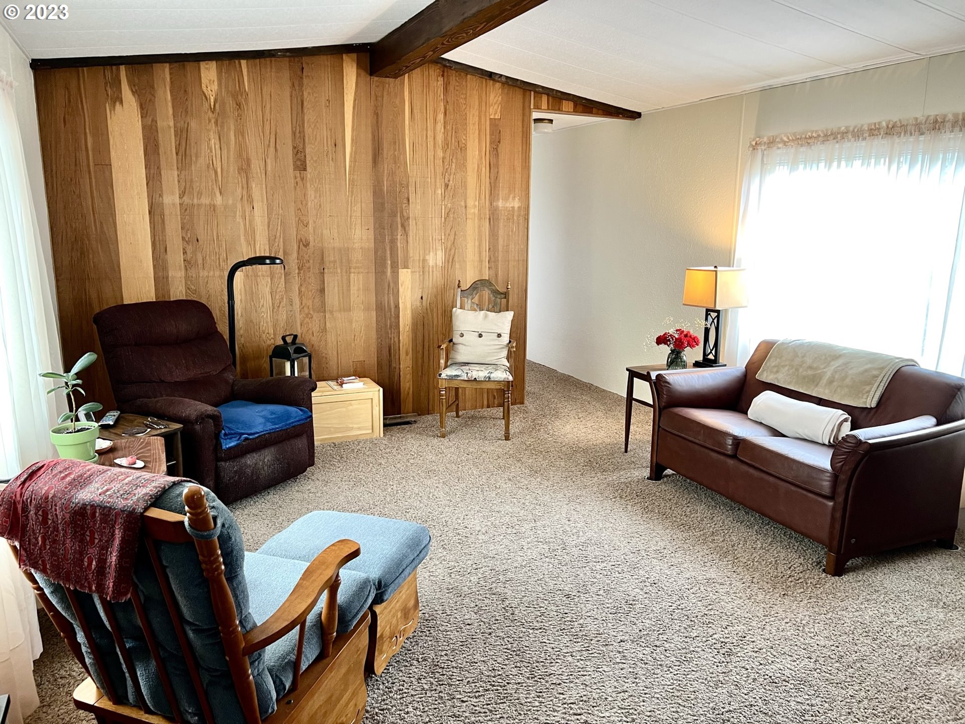 1601 Rhododendron Drive, Unit 586 Florence, OR 97439 - Photo 6 of 22 a living room with furniture and a window