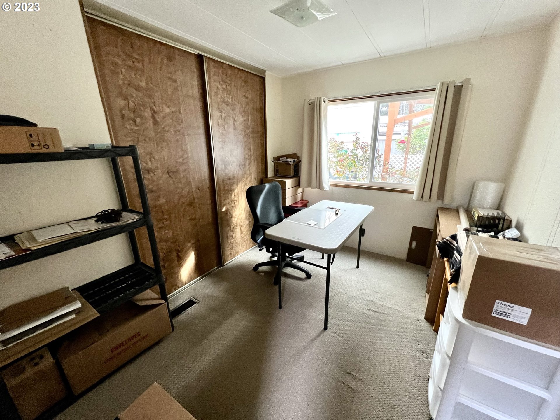 1601 Rhododendron Drive, Unit 586 Florence, OR 97439 - Photo 8 of 22 a room with gym equipment and a window