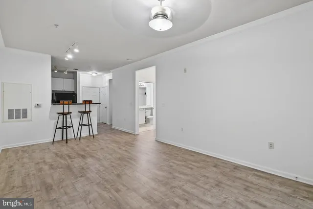 a view of kitchen with furniture and a refrigerator