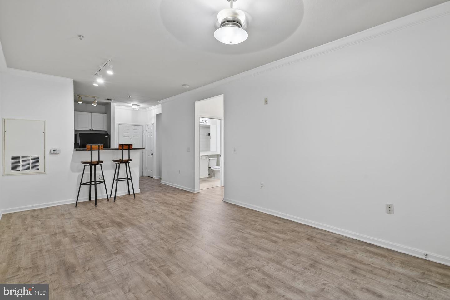9490 Virginia Center Boulevard, Unit 127 Vienna, VA 22181 - Photo 12 of 31 a view of kitchen with furniture and a refrigerator