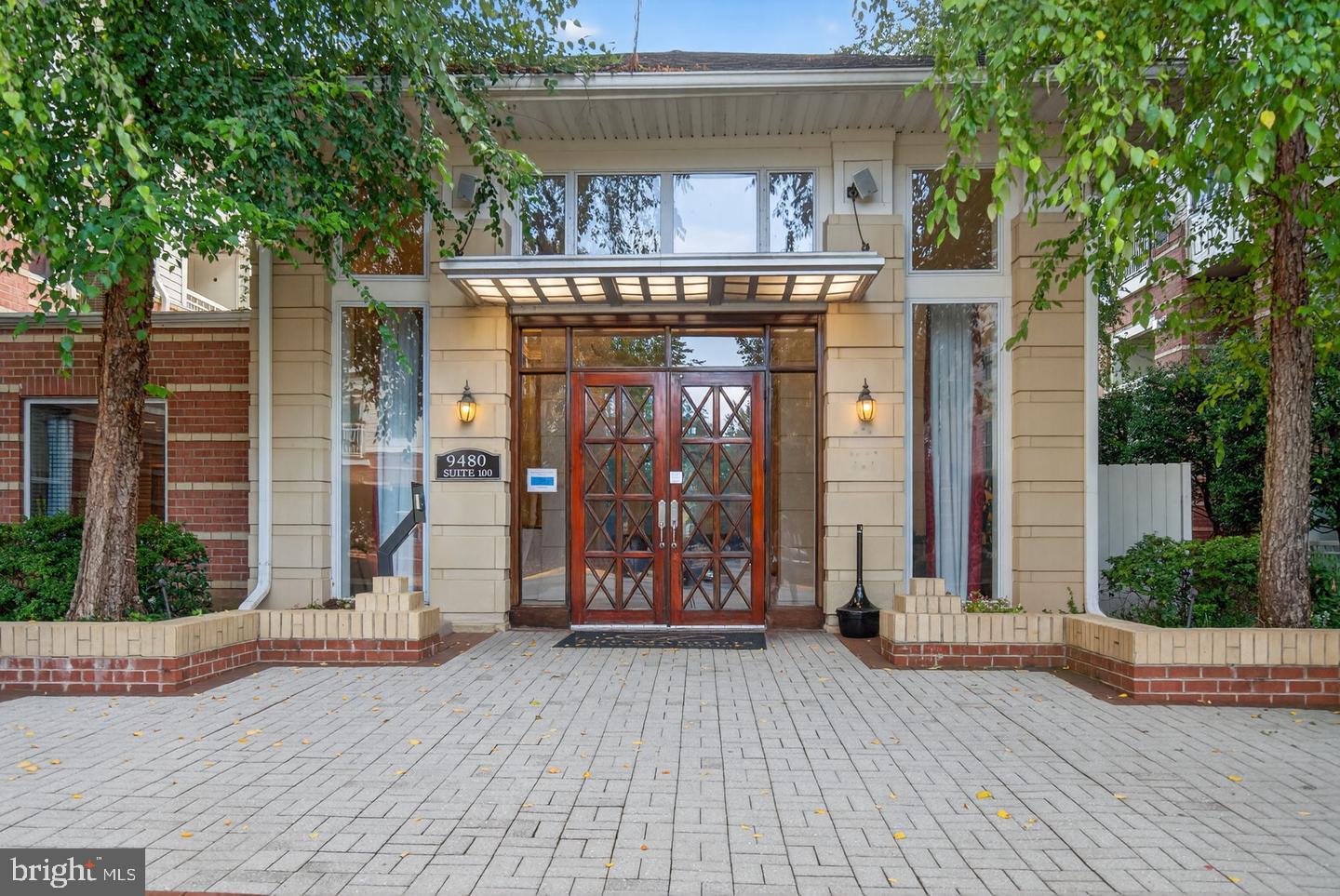 9490 Virginia Center Boulevard, Unit 127 Vienna, VA 22181 - Photo 2 of 31 a view of outdoor space with wooden floor and tree