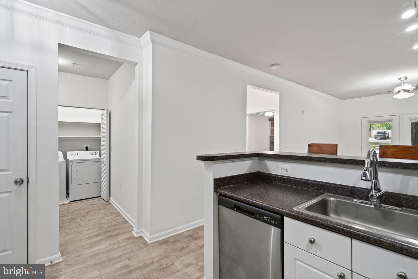 9490 Virginia Center Boulevard, Unit 127 Vienna, VA 22181 - Photo 8 of 31 a kitchen with a sink and a refrigerator
