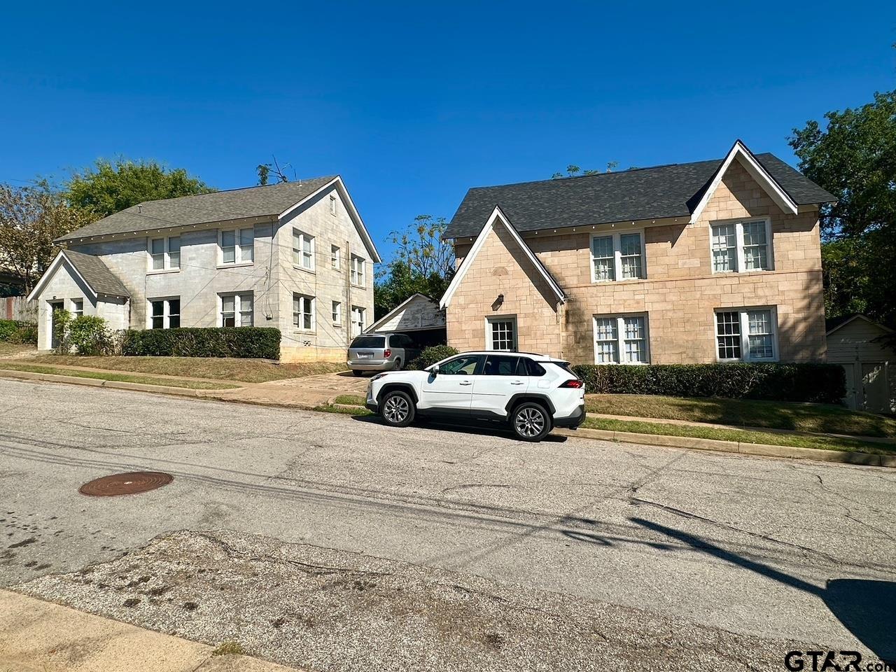 128-130 Rowland Place Tyler, TX 75701 - Photo 2 of 6 a view of white house with a yard