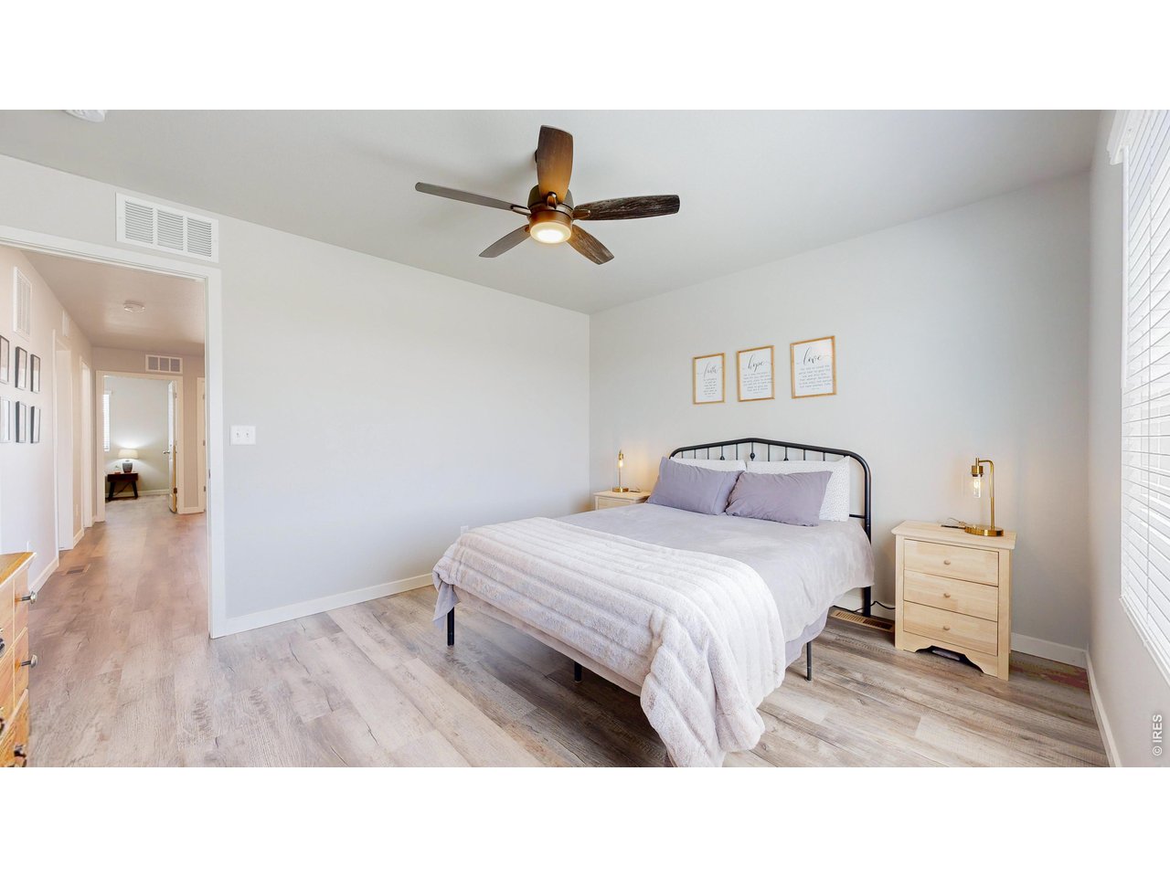 260 Pawnee Road, Unit D3 Ault, CO 80610 - Photo 20 of 44 Primary bedroom has open views, LVP flooring, closet and ceiling fan.