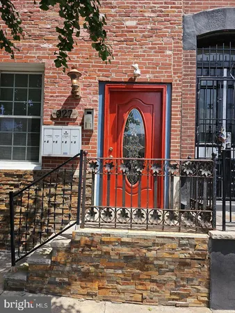 a view of front door and small yard