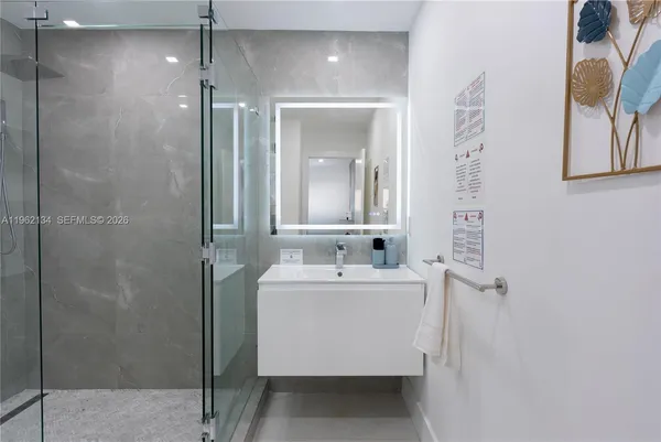 a bathroom with a sink and mirror