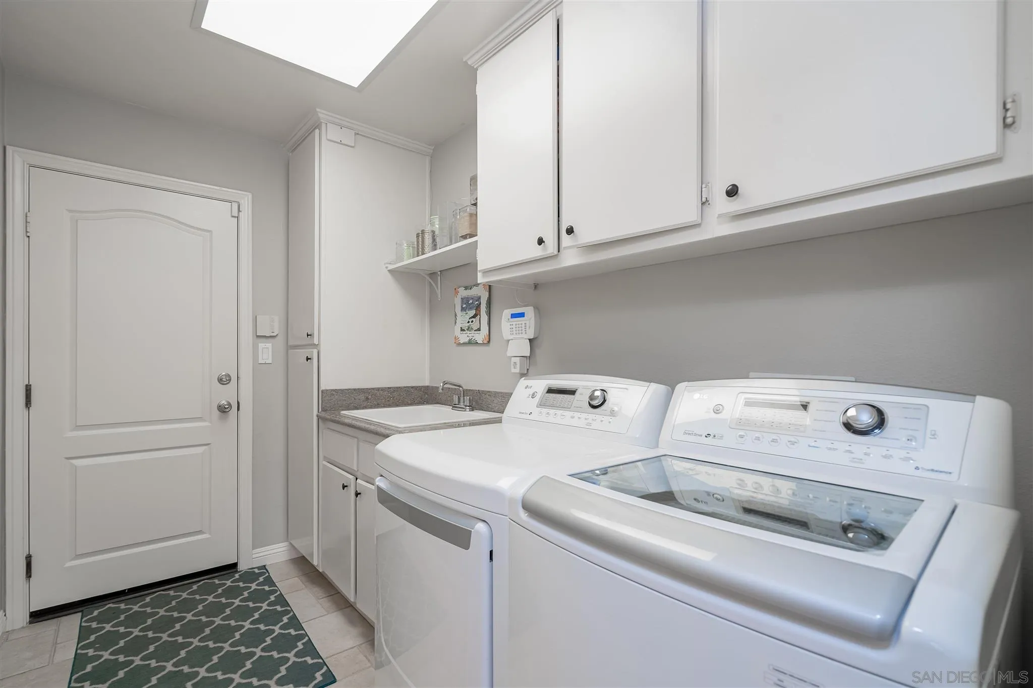 6716 Tea Tree Street Carlsbad, CA 92011 - Photo 14 of 39 a utility room with dryer and washer