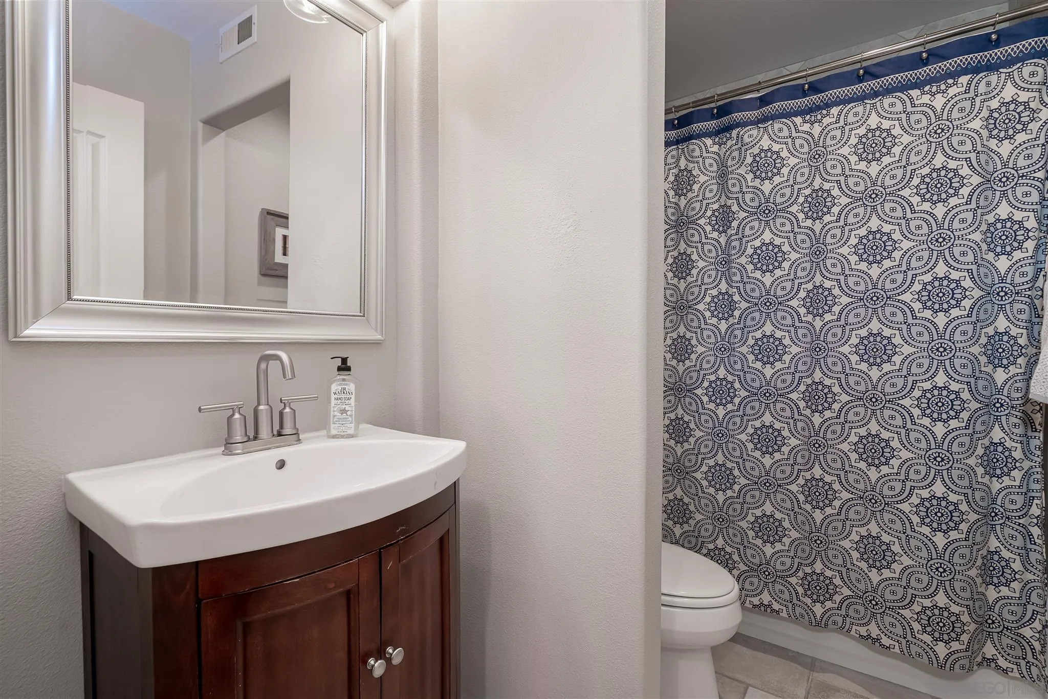 6716 Tea Tree Street Carlsbad, CA 92011 - Photo 15 of 39 a bathroom with a sink and a toilet
