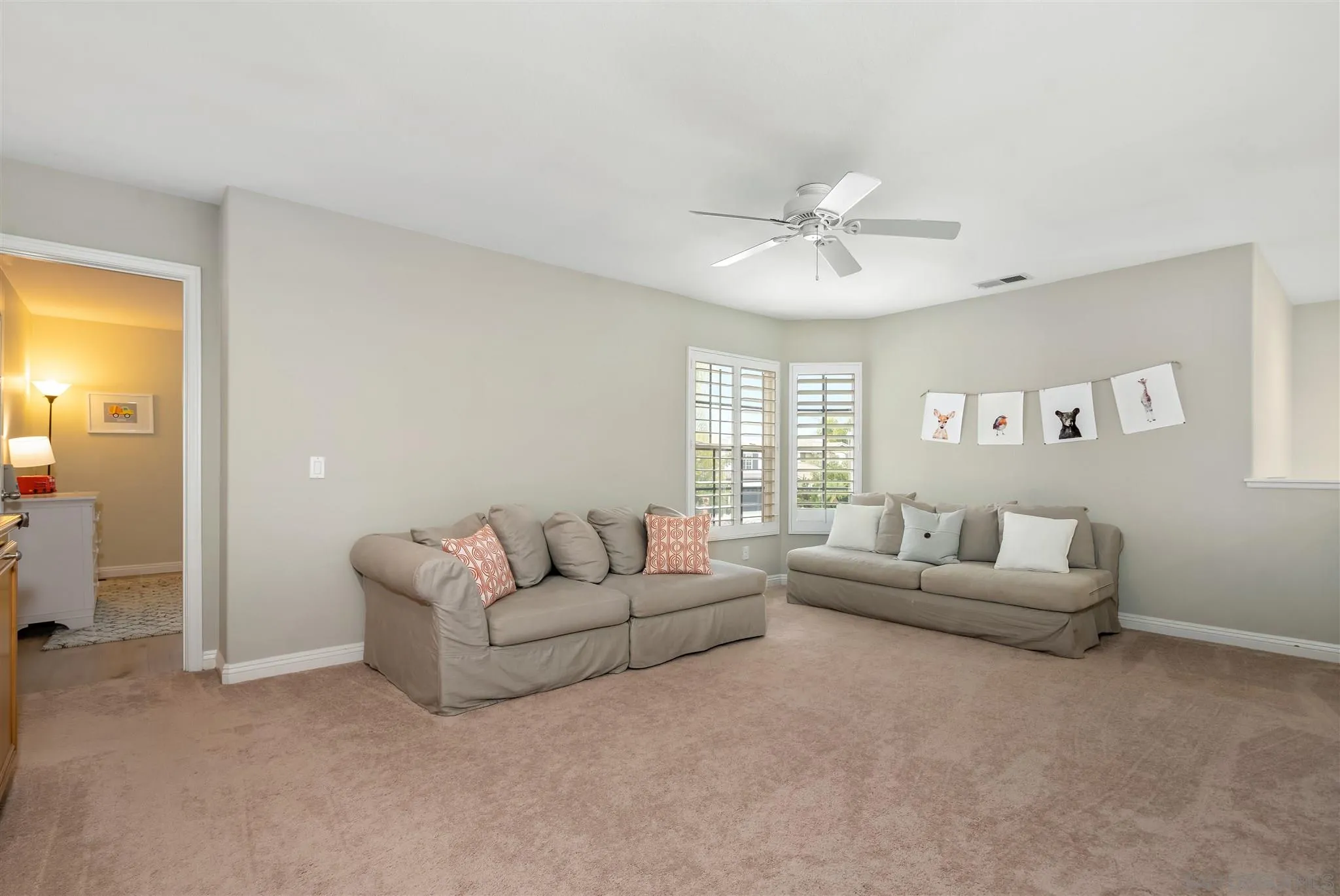 6716 Tea Tree Street Carlsbad, CA 92011 - Photo 19 of 39 a living room with furniture and a large window