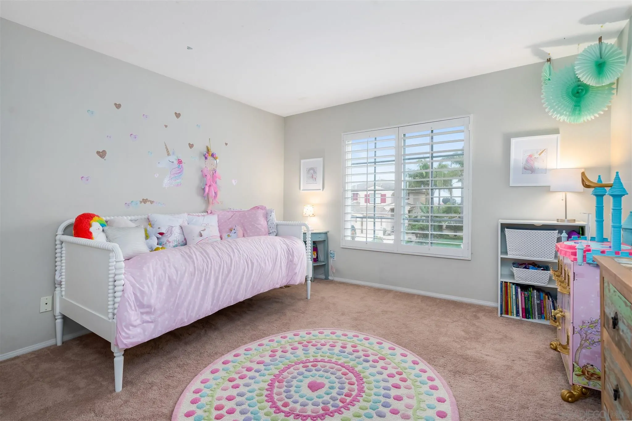 6716 Tea Tree Street Carlsbad, CA 92011 - Photo 24 of 39 a bedroom with a bed and a window