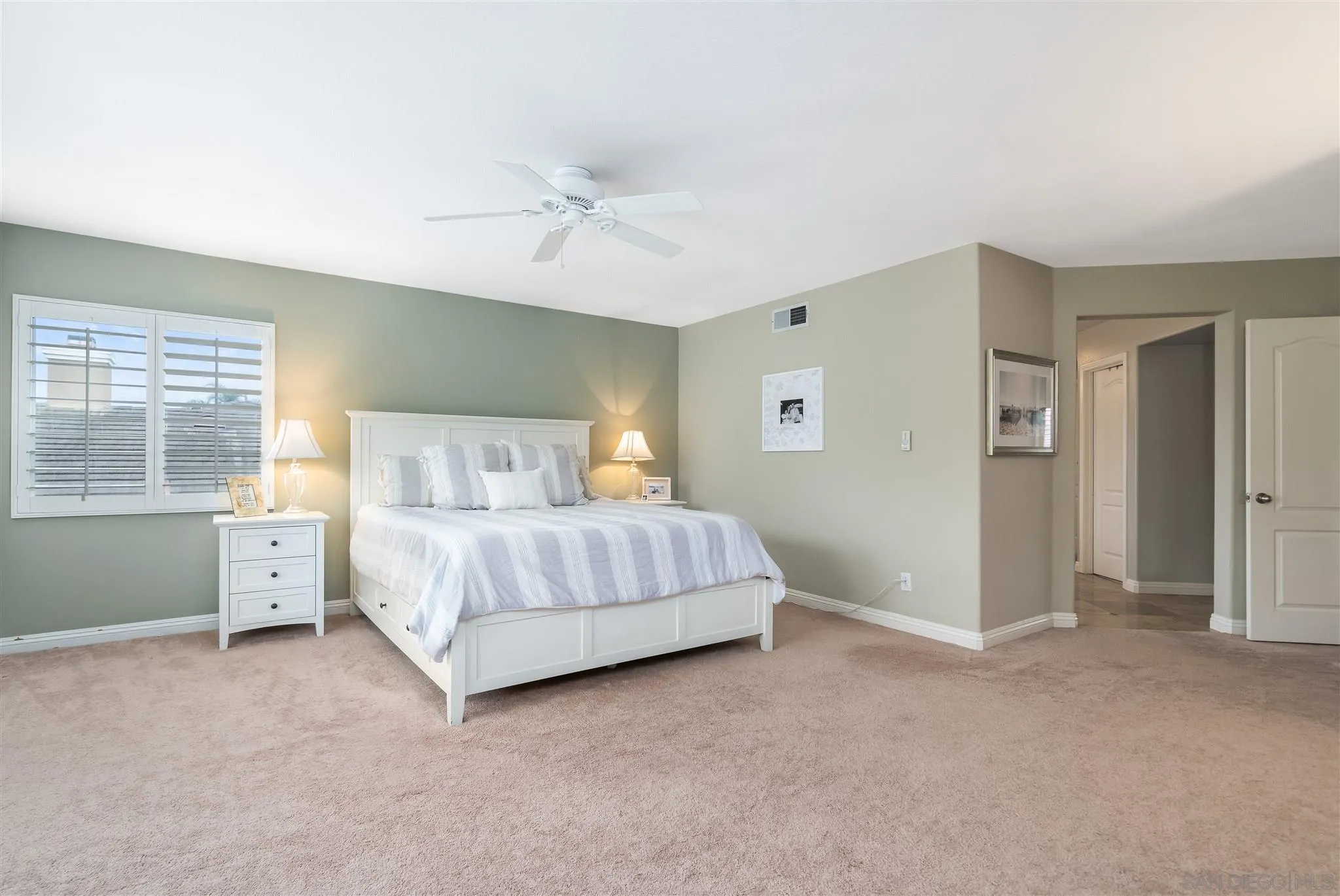 6716 Tea Tree Street Carlsbad, CA 92011 - Photo 27 of 39 a bedroom with a bed and a window