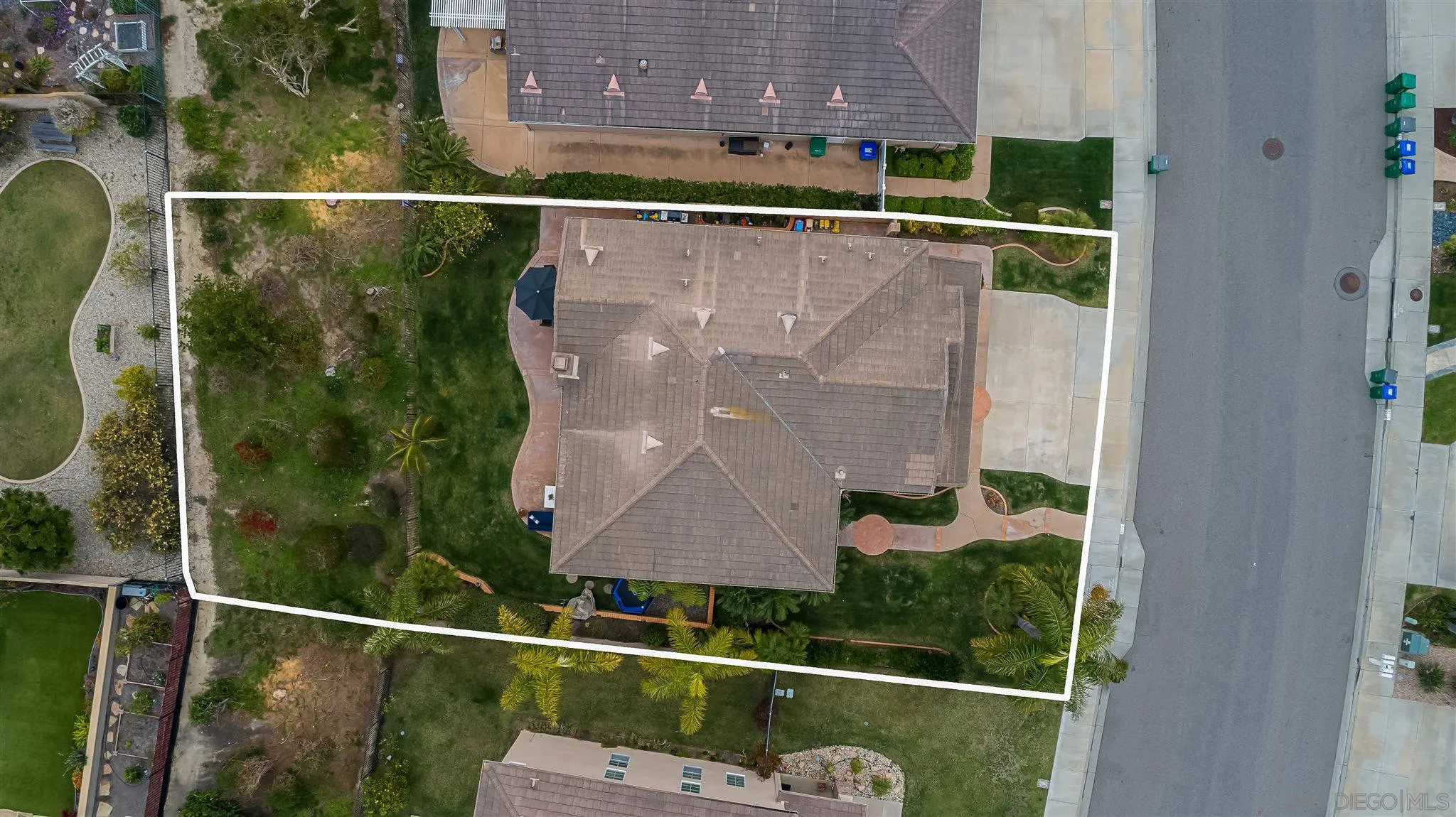 6716 Tea Tree Street Carlsbad, CA 92011 - Photo 36 of 39 an aerial view of a house with a yard