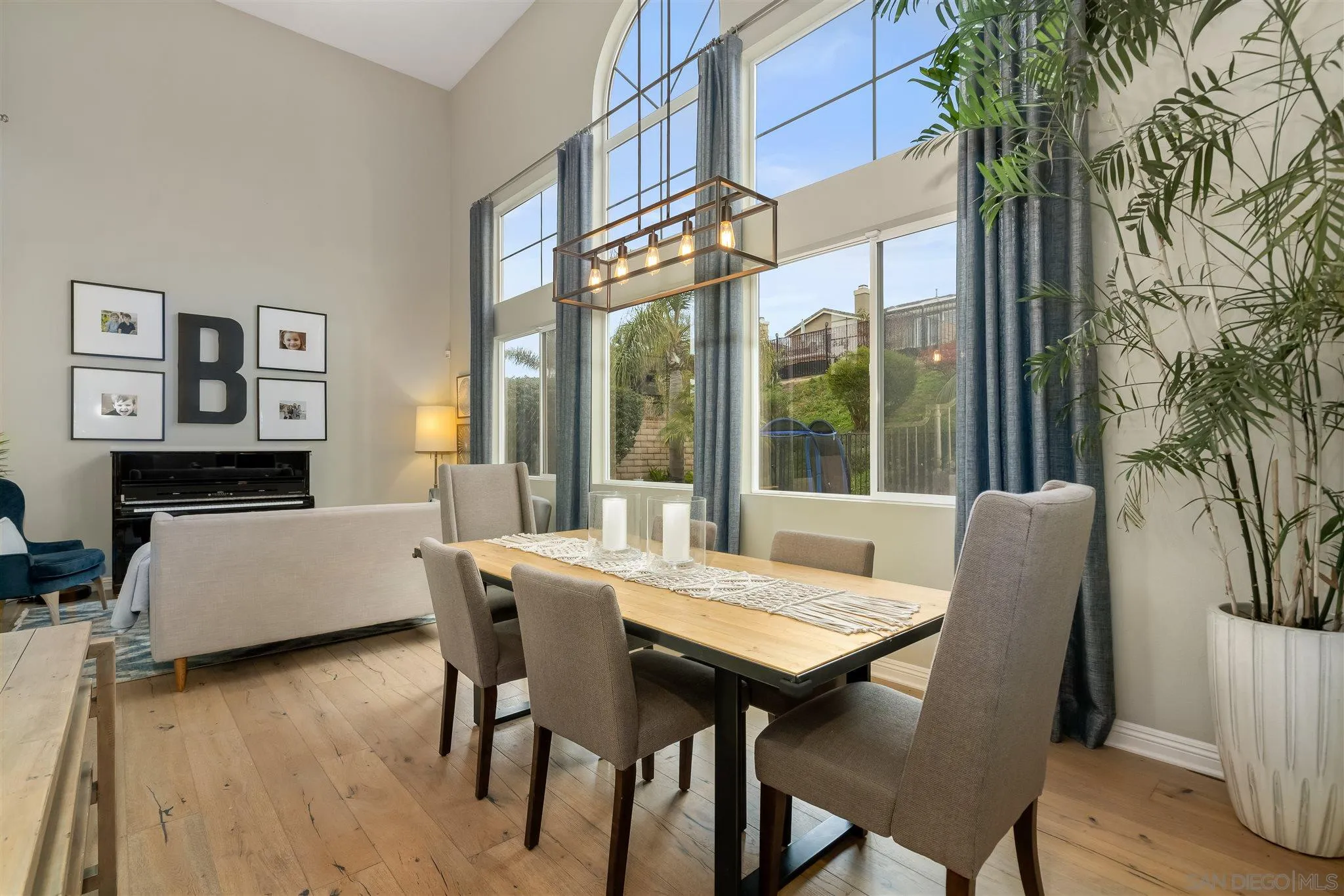 6716 Tea Tree Street Carlsbad, CA 92011 - Photo 7 of 39 a view of a dining room with furniture window and wooden floor