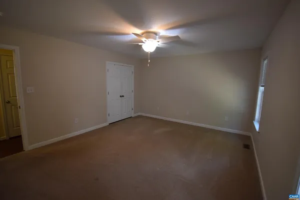 a view of a chandelier fan in a room