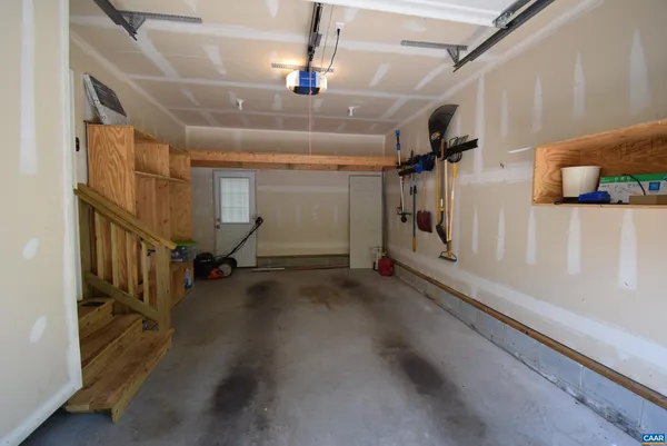 a view of a hallway with staircase