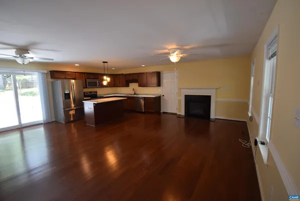 a view of kitchen and dining room with wooden floor