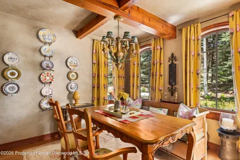 a view of a dining room with furniture and window