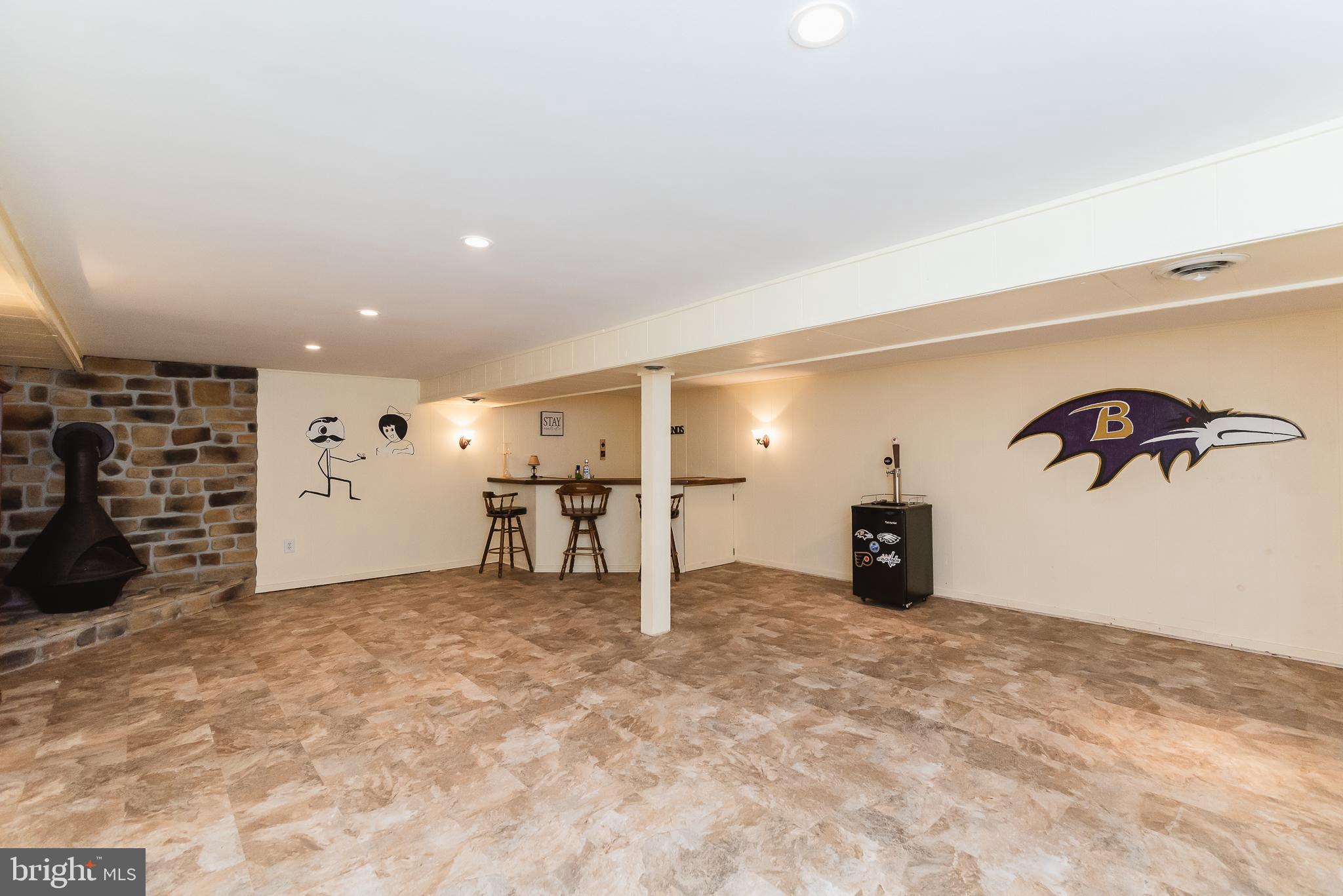 2503 Hess Road Fallston, MD 21047 - Photo 10 of 45 Finished LL with Bar & Stone Wood Stove