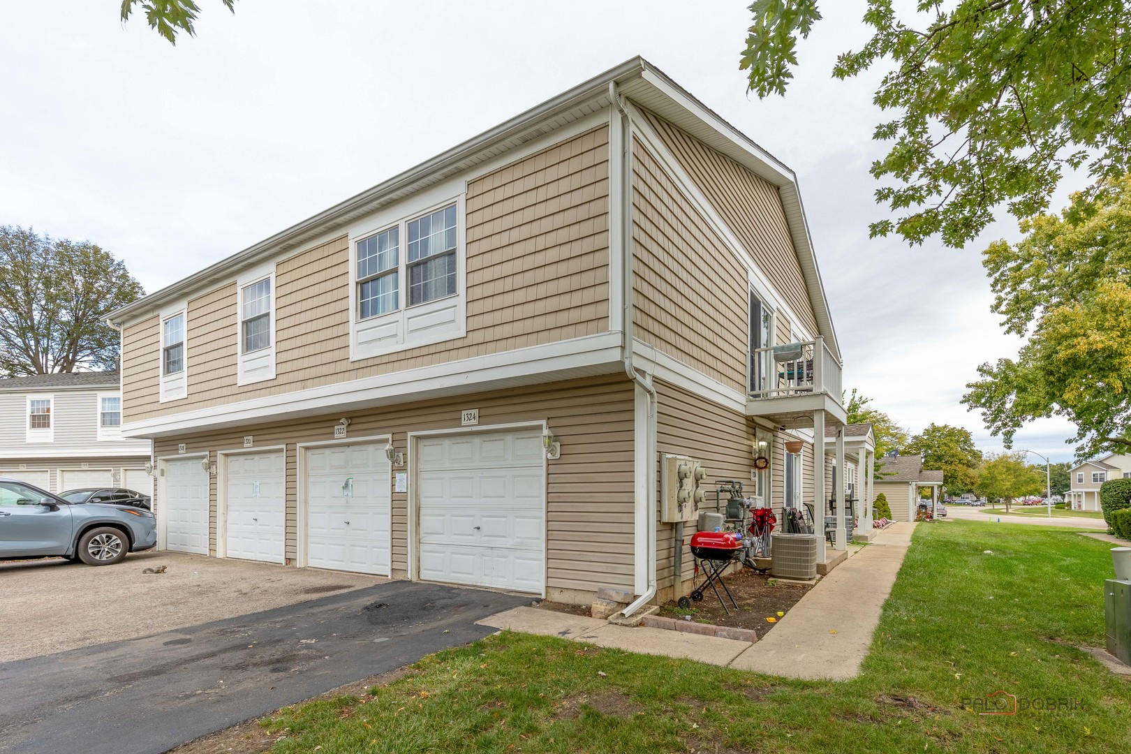 1324 Alpine Court, Unit 1324 Wheeling, IL 60090 - Photo 1 of 12 a view of a house with a yard