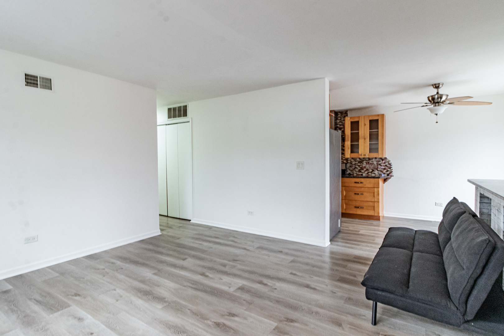 1324 Alpine Court, Unit 1324 Wheeling, IL 60090 - Photo 2 of 12 a view of livingroom with furniture and wooden floor